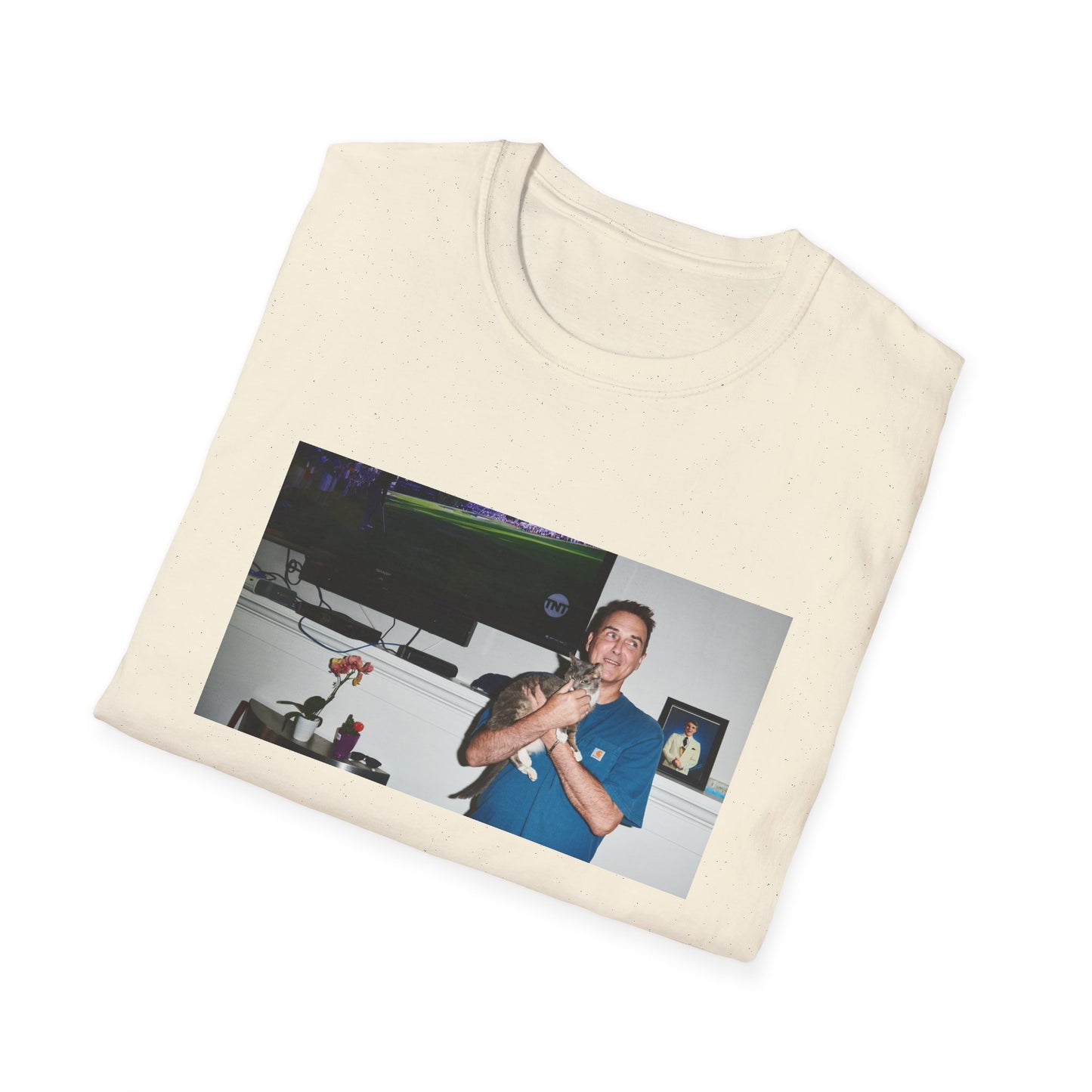 norm macdonald and his cat in front of a framed picture of steve martin tshirt