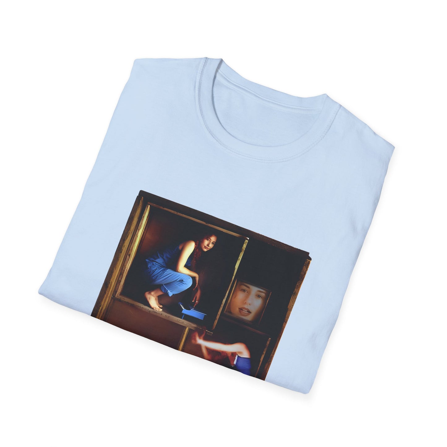 tori amos on a shelf in a crate playing a small piano surrounded by other amos's on a tshirt