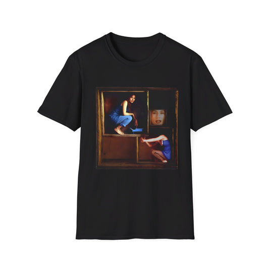 tori amos on a shelf in a crate playing a small piano surrounded by other amos's on a tshirt