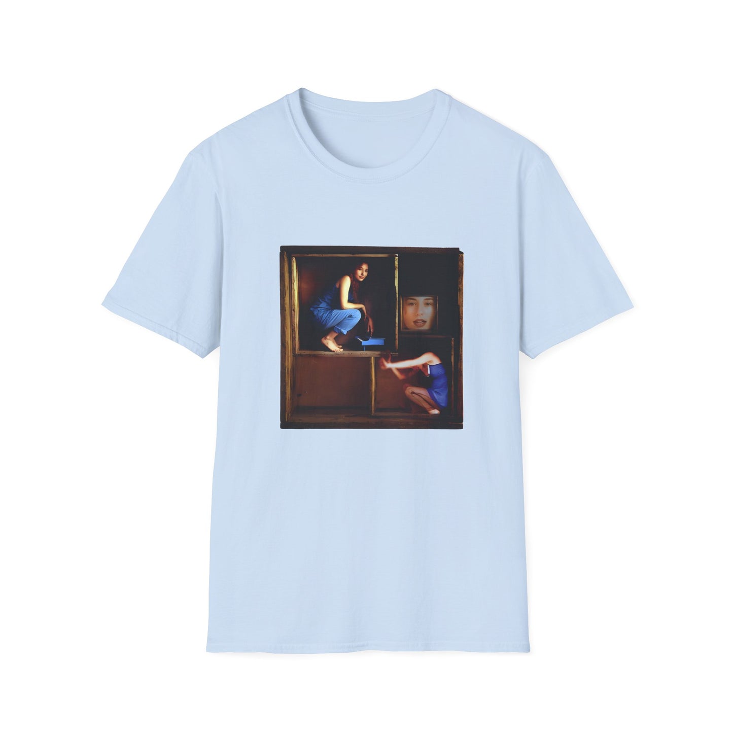 tori amos on a shelf in a crate playing a small piano surrounded by other amos's on a tshirt