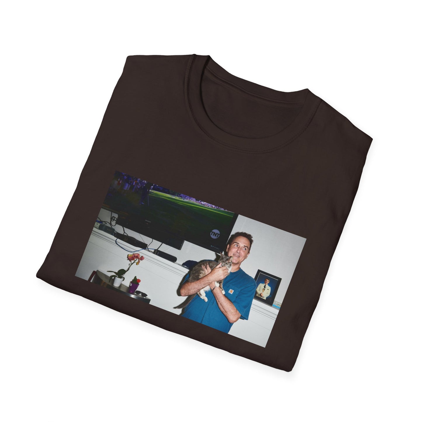 norm macdonald and his cat in front of a framed picture of steve martin tshirt