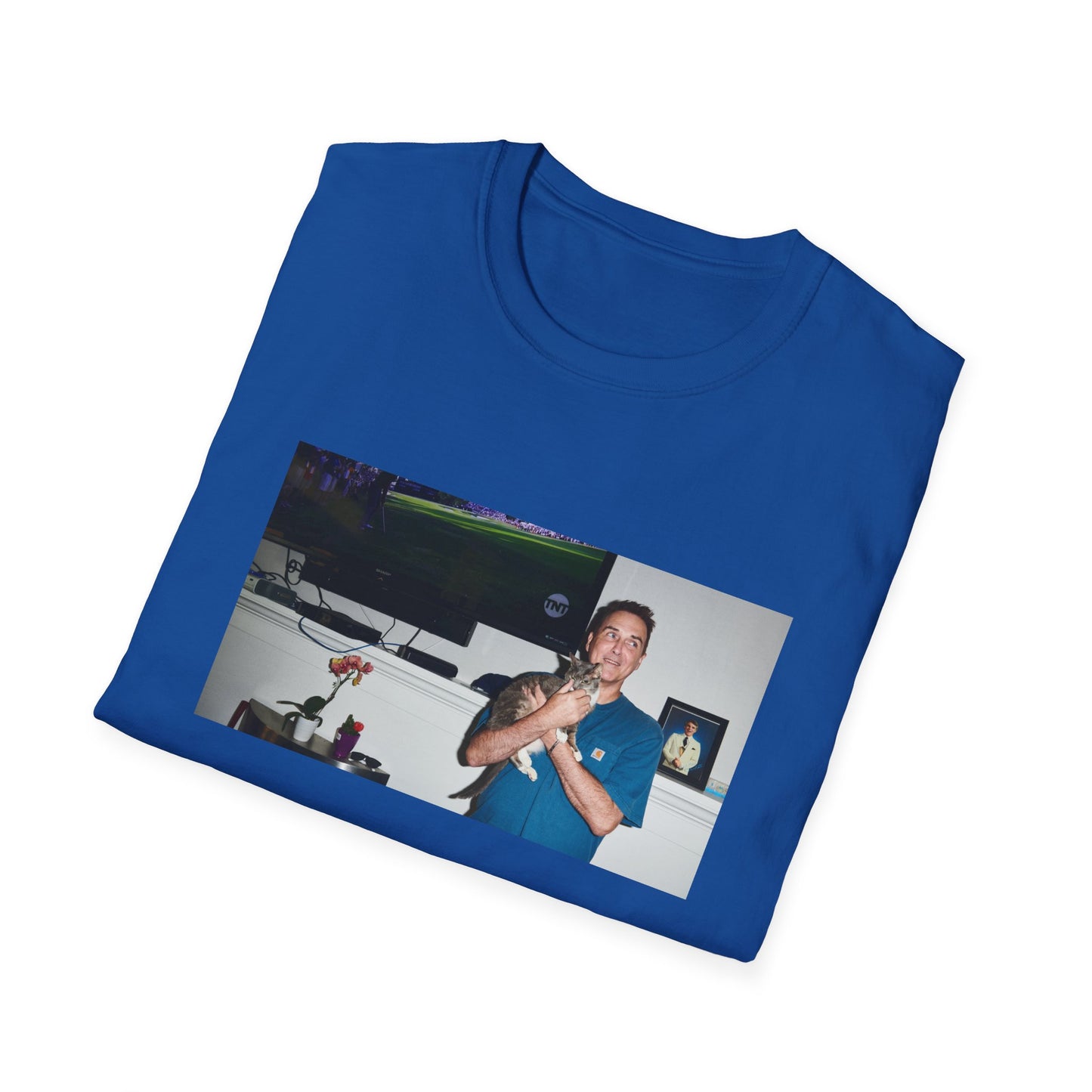 norm macdonald and his cat in front of a framed picture of steve martin tshirt