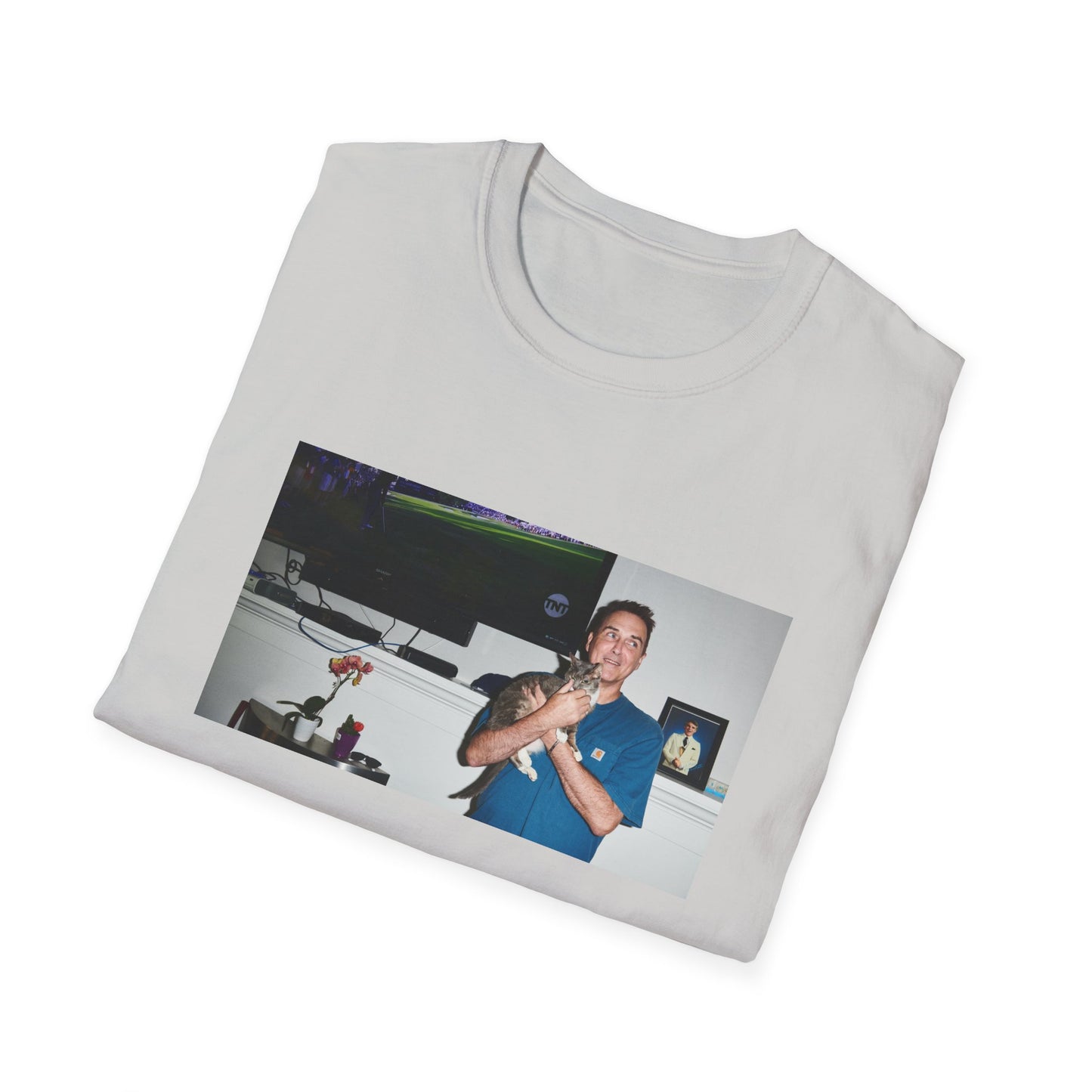 norm macdonald and his cat in front of a framed picture of steve martin tshirt