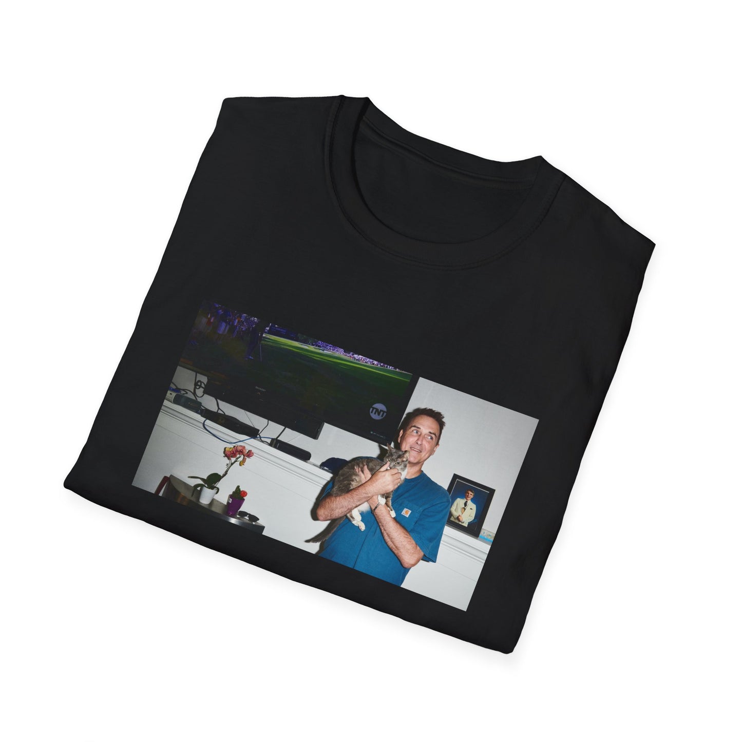 norm macdonald and his cat in front of a framed picture of steve martin tshirt