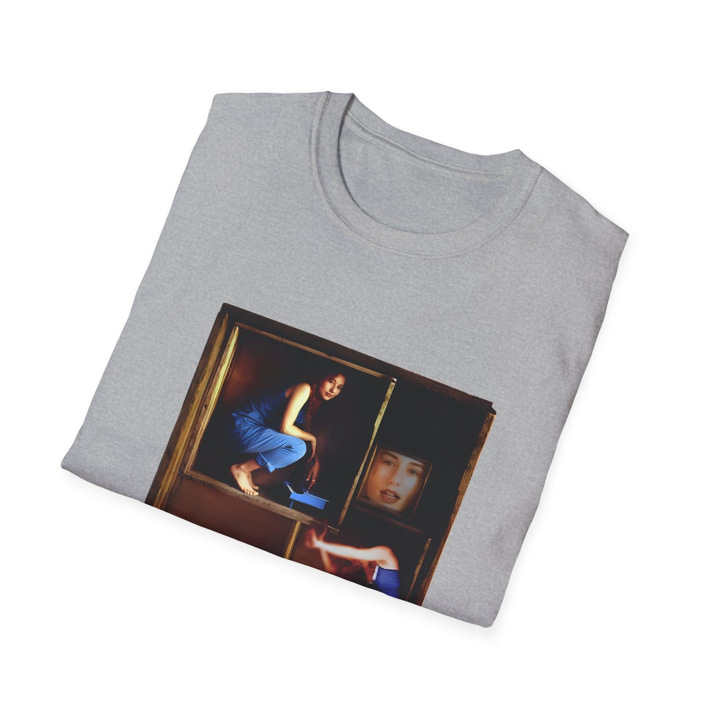 tori amos on a shelf in a crate playing a small piano surrounded by other amos's on a tshirt