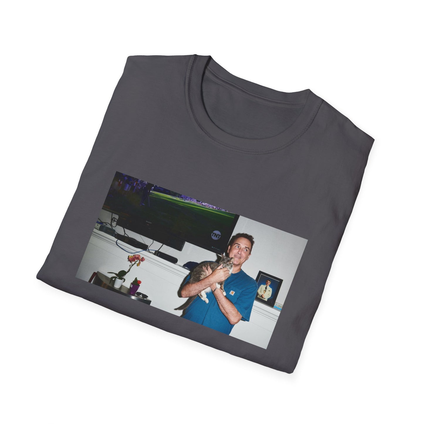 norm macdonald and his cat in front of a framed picture of steve martin tshirt