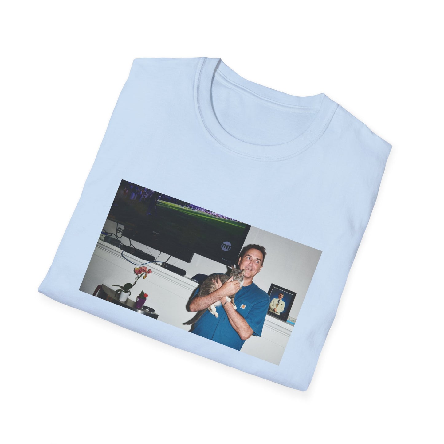 norm macdonald and his cat in front of a framed picture of steve martin tshirt