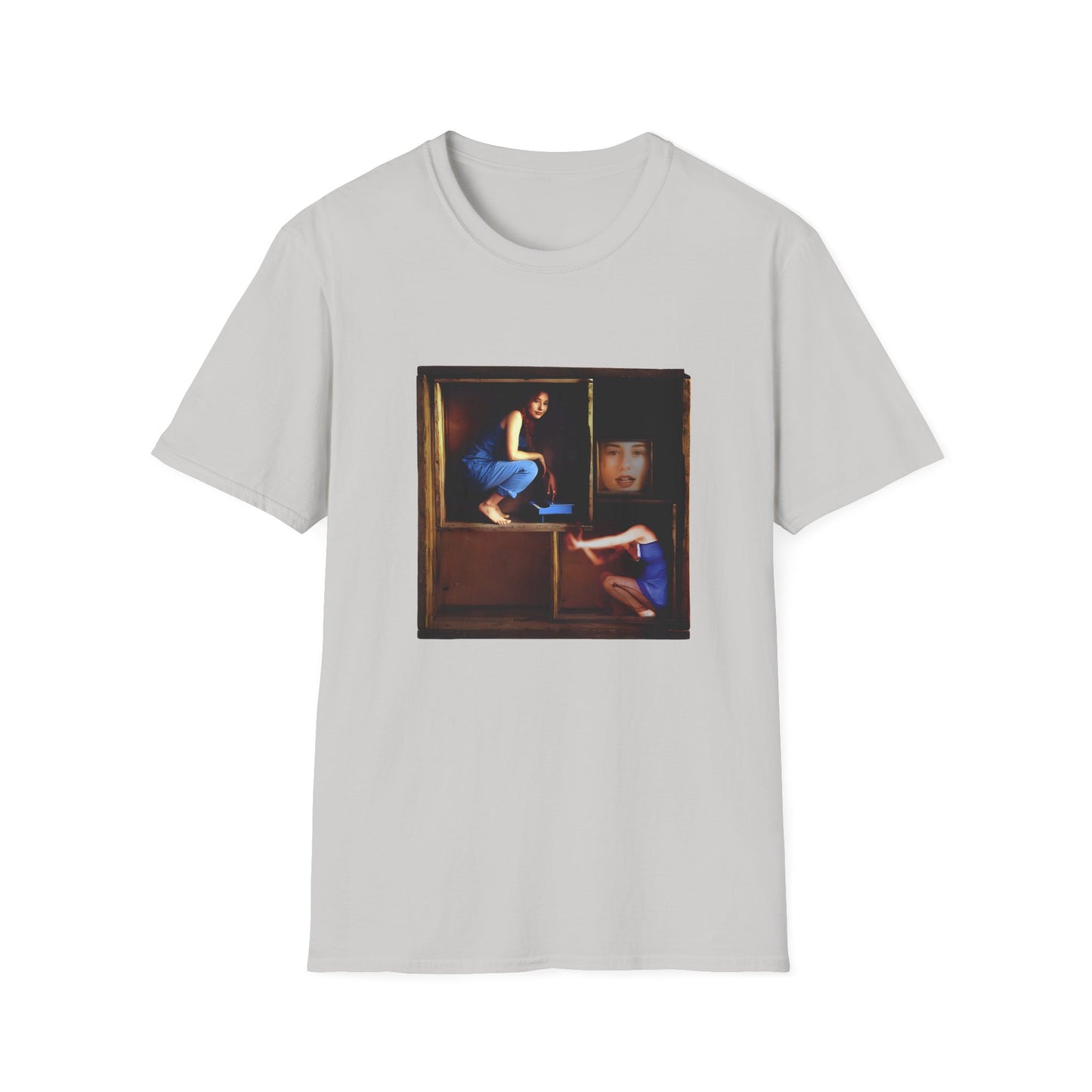 tori amos on a shelf in a crate playing a small piano surrounded by other amos's on a tshirt