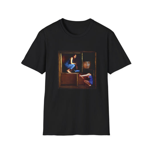 tori amos on a shelf in a crate playing a small piano surrounded by other amos's on a tshirt