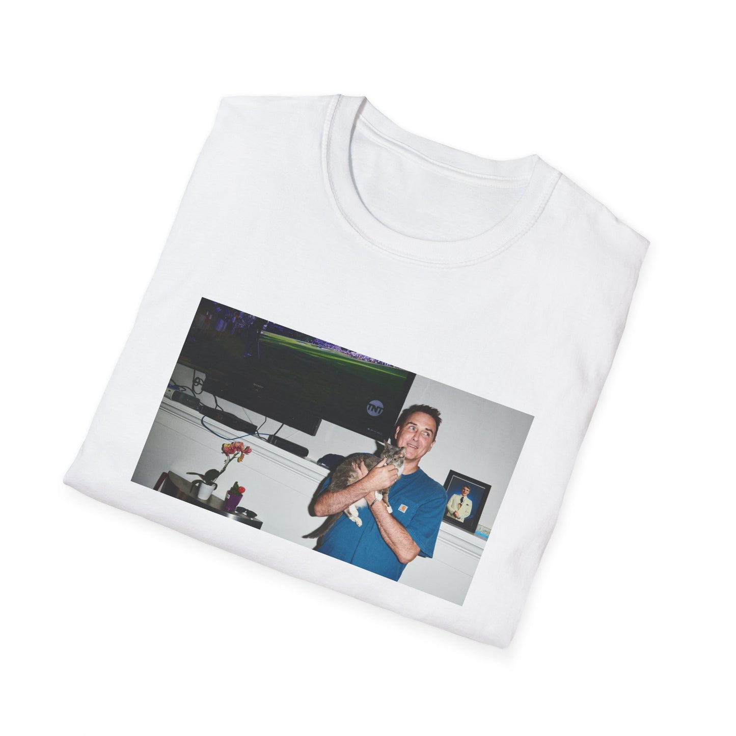 norm macdonald and his cat in front of a framed picture of steve martin tshirt