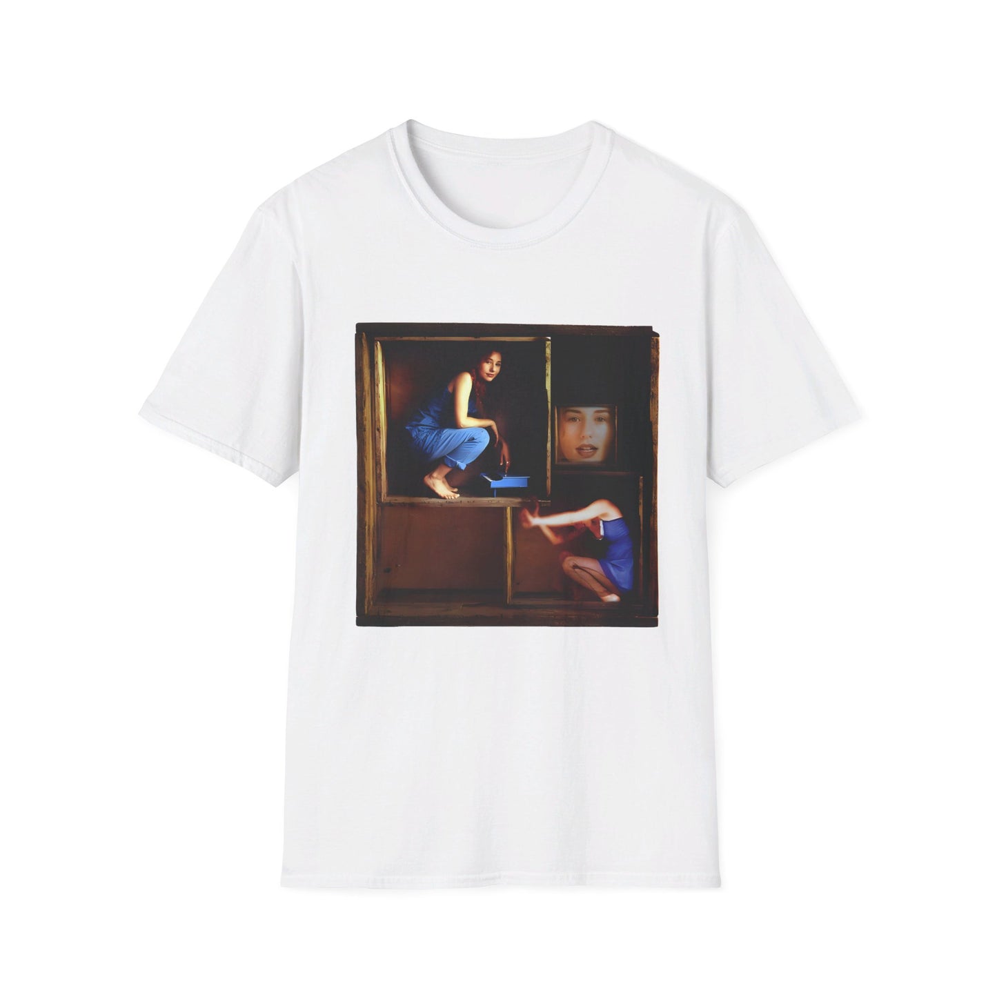 tori amos on a shelf in a crate playing a small piano surrounded by other amos's on a tshirt