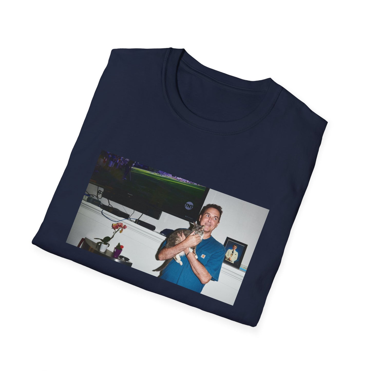 norm macdonald and his cat in front of a framed picture of steve martin tshirt